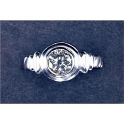 PLATINUM SOLITAIRE RING, bezel set with a brilliant cut diamond (approx. 0.83ct.) in a mount with...
