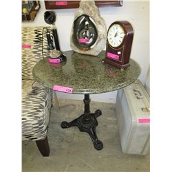 Marble top table with a cast pedestal base