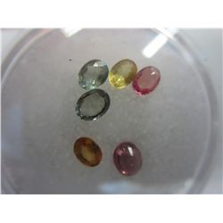 Gem jar filled with oval cut sapphires