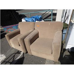 2 beige upholstered armchairs.