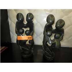 2 Carved stone statues 16" tall. 4" dia.
