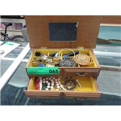 Wood jewelry box filled with jewelry
