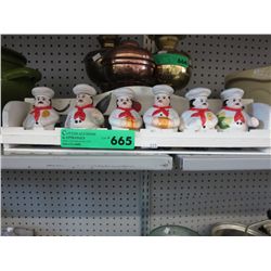 Glazed ceramic spice jars in a rack