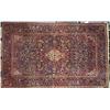 Image 1 : A KASHAN RUG, c.1920, the blue floral field with a red pendant medallion enclosed by red spandrel...