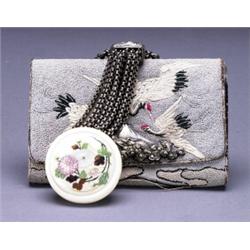 A FINE KINCHAKU, the case embroidered with cranes and Mt. Fuji, the silver clasp showing Mt. Fuji...
