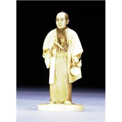 AN IVORY OKIMONO OF A GENTLEMAN, dressed in a textured robe with mother-of-pearl inlaid jacket, w...