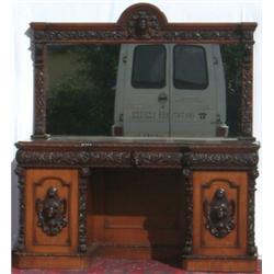 Victorian heavily carved oak mirror-back inverted breakfront twin pedestal...