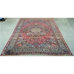 Antique Persian Kirman Laver carpet with a pattern of meandering flowers on...
