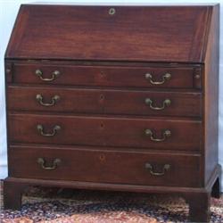 C18th George III mahogany fall-front bureau with fitted interior above 4 long...