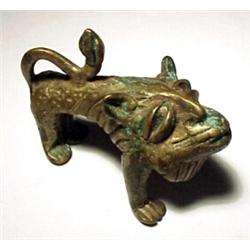 WEST AFRICA, GOLD COAST (GHANA), Ashanti Tribe, c. 1900-1925, a fine small standing brass lion....