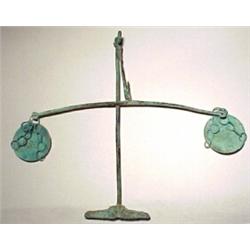 Roman, c. 400 AD. a simple equal arm beam scale with small round scyphate-shaped pans connected...