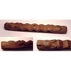Peru, Northern Coast, Moche Culture, c. 500 AD. a finely carved wooden balance beam in the form...