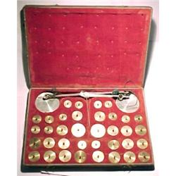 Germany, Berlin, c. 1850, a leather boxed coin scale with thirty-six round knobbed weights each h...