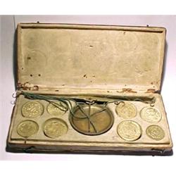 Italy, c. 1800, a rectangular boxed scale with a fine set of fifteen round brass coin weights se...