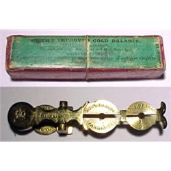 England, C. 1850, a brass "rocker" for sovereigns and half sovereigns. With the original box, ma...