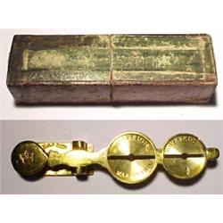 England, C. 1850, a brass "rocker" for sovereigns and half sovereigns. With the original box, ma...