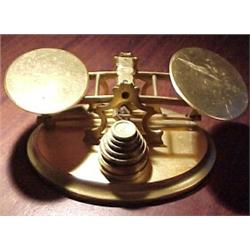 Great Britain, c. 1880, a similar postal scale all in polished brass with a seven piece central...