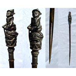 Burma, c. 1895, a tattoo maker's tattooing needle. The top silver handle depicts the tattooer kn...