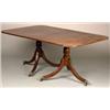 Image 1 : Regency mahogany dining table having a reeded edge, standing on two snap top pedestals with ring...