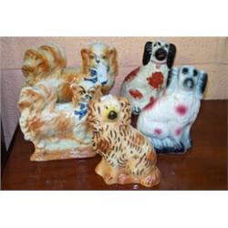 Five various Staffordshire comforter spaniels, 19cms - 23cms high Est.: £80 - £120...