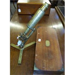 Mid 19th Century brass microscope on a folding triangular stand. Engraved 'Improved Compound Micr...