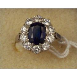 Platinum cluster ring set central sapphire within a diamond surround Est.: £1500 - £2000...