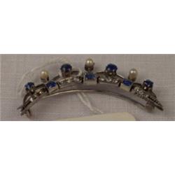 White metal crescent shaped brooch set diamonds, sapphires and seed pearls Est.: £500 - £650...