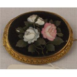 19th Century oval brooch set floral pietra dura panel within a gilt metal mount, the reverse with...