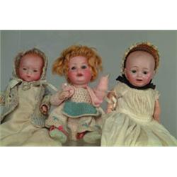 LOT OF 3 BISQUE SOCKET HEAD BABY DOLLS.