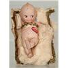 Image 1 : RARE CHARACTER KEWPIE BISQUE DOLL ON PILLOW.