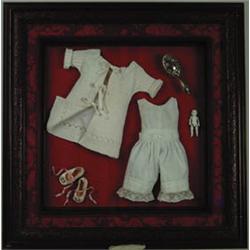 SHADOWBOX DISPLAY OF DOLL & CLOTHES.