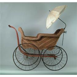 VICTORIAN ROLLED WICKER BABY CARRIAGE.