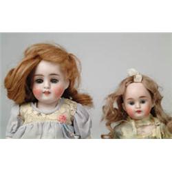 PAIR OF ALL BISQUE DOLLS.