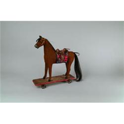 ANTIQUE CHILD'S WOOL COVERED HORSE ON WHEELS PULL TOY.