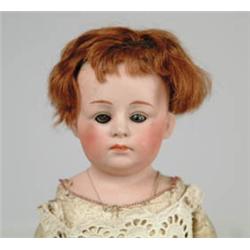 15" BISQUE SHOULDER HEAD DOLL ON KID BODY.