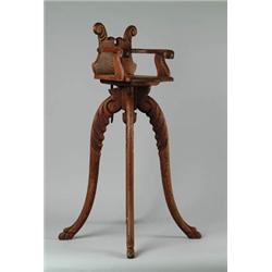 UNUSUAL DOLL'S OR SMALL CHILD'S OAK ORNAMENTAL HIGH CHAIR.
