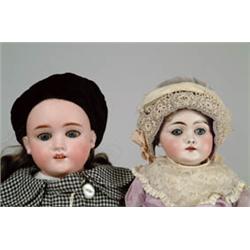 LOT OF TWO GERMAN BISQUE SHOULDER HEAD DOLLS WITH KID BODIES.