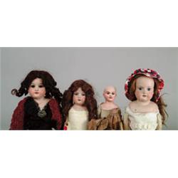 LOT OF FOUR GERMAN BISQUE SHOULDER HEAD DOLLS.