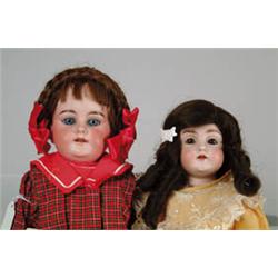 LOT OF TWO GERMAN BISQUE SHOULDER HEAD DOLLS WITH KID BODIES.