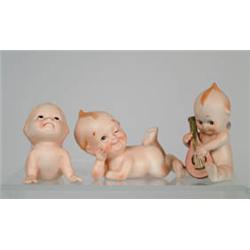 LOT OF THIRTEEN BISQUE ACTION KEWPIES (NEWER).