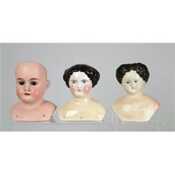 BOX LOT OF 16 DOLL HEADS.