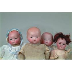LOT OF FOUR GERMAN BISQUE HEAD BABIES.