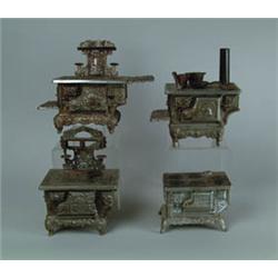 LOT OF FOUR CAST METAL DOLL STOVES.