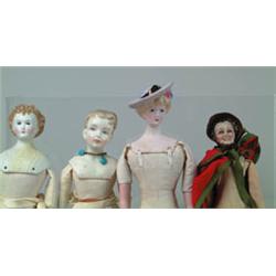 LOT OF 4 BISQUE SHOULDER HEAD DOLLS.