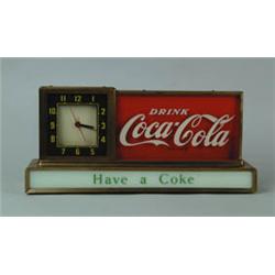 LIGHT UP COUNTER COKE CLOCK AND ADVERTISING SIGN.