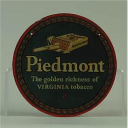 ROUND DISC ADVERTISEMENT FOR PIEDMONT CIGARETTES.