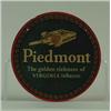 ROUND DISC ADVERTISEMENT FOR PIEDMONT CIGARETTES.