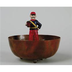 CI SOLDIER STANDING IN COPPER BOWL.  