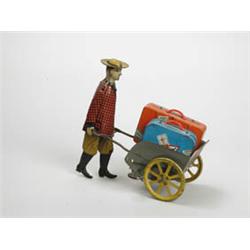 WOODS/GIRARD MAN WITH LUGGAGE CART.