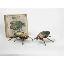 PAIR OF TIN WINDUP BEETLES.